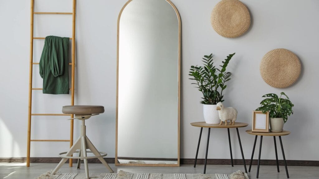 Well Lit plants and mirror, mirrors are one of the most important things to maximize space on the house staging checklist