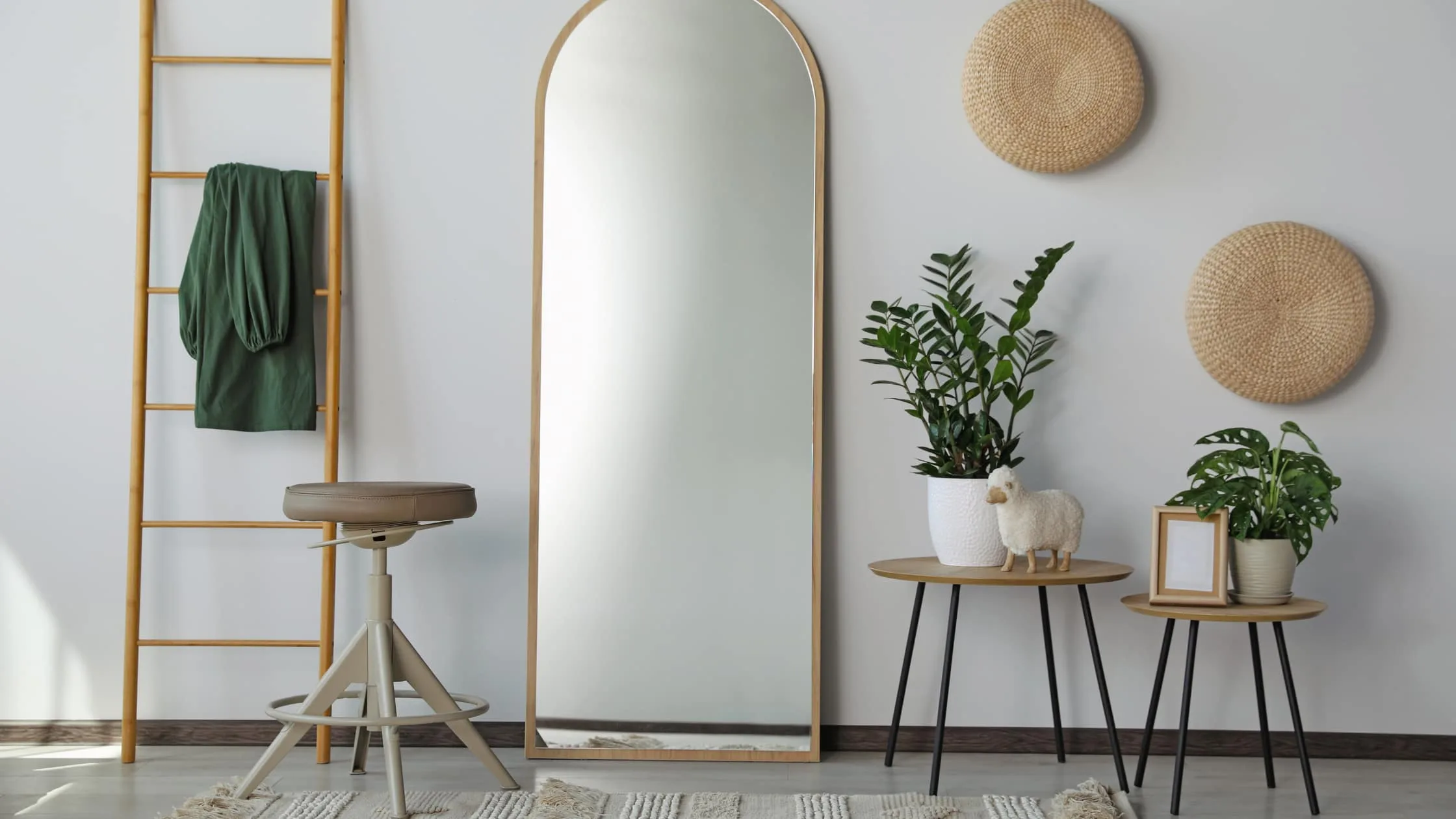Well Lit plants and mirror, mirrors are one of the most important things to maximize space on the house staging checklist