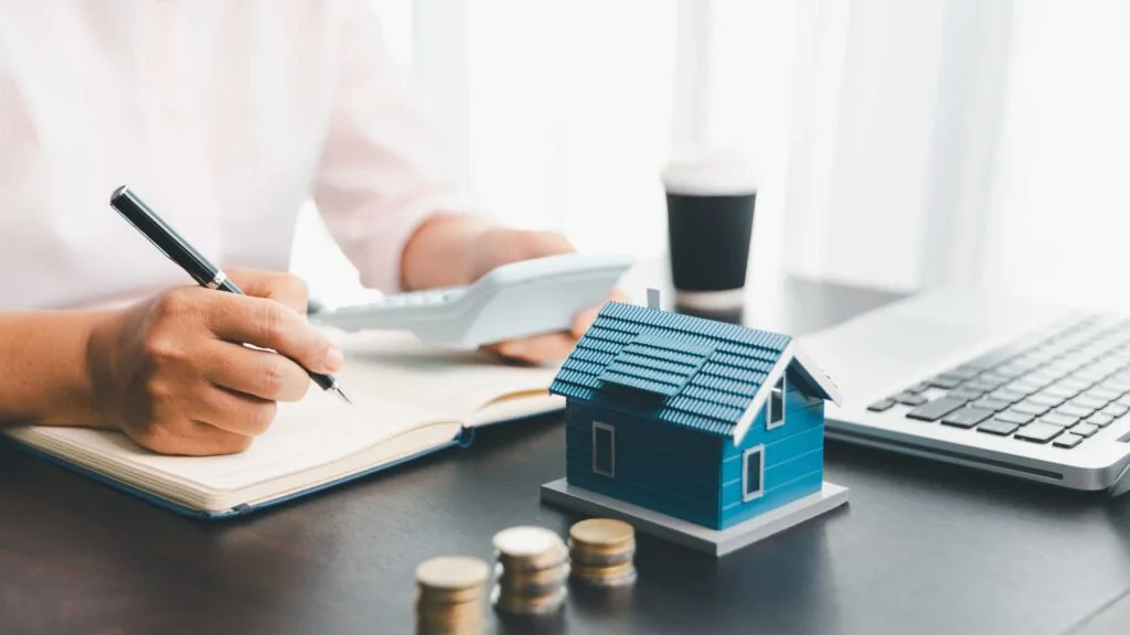 colorado down payment assistance paperwork review with mini house