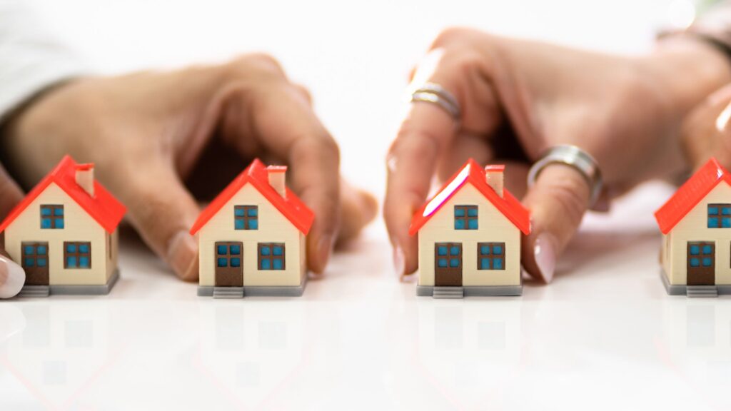 colorado hoa rules board decision with hands moving house pieces