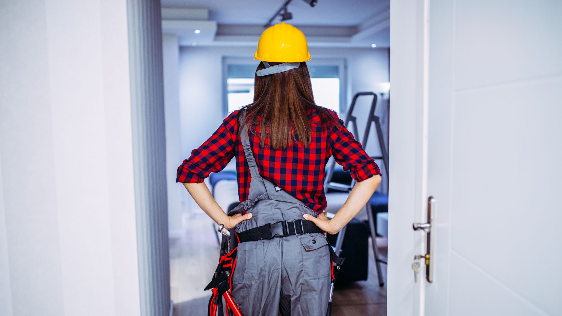 Contractor evaluating a home to decide what not to fix when selling a house