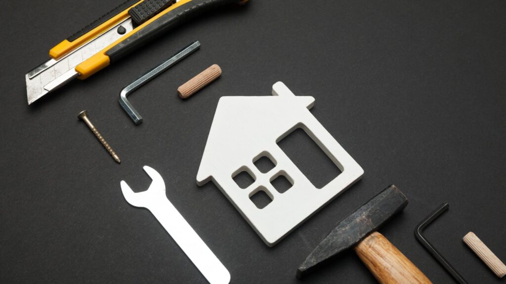 Home repair tools and house icon representing what not to fix when selling a house